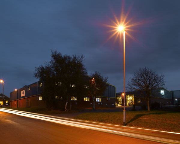 CCL's Honiton warehouse and office at dusk atmospherically lit by a nearby streetlamp
